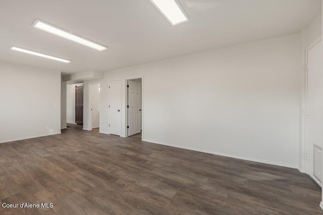 14895 N Crystal Springs Ln, Rathdrum, ID 83858 - spare room with dark wood-style flooring and baseboards