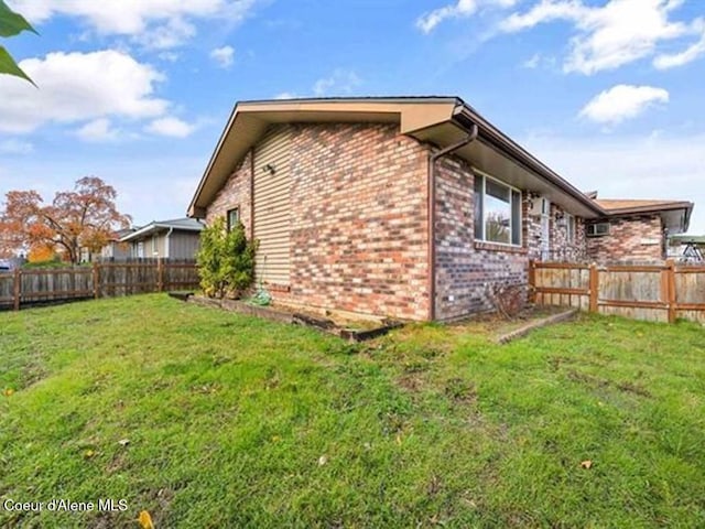 view of home's exterior featuring a lawn