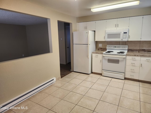 kitchen with backsplash, light tile patterned floors, white cabinets, white appliances, and baseboard heating