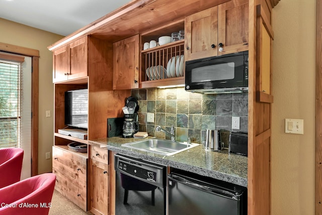 kitchen featuring decorative backsplash, black appliances, and sink