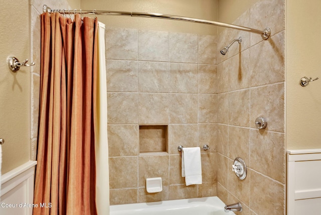 bathroom with shower / tub combo with curtain