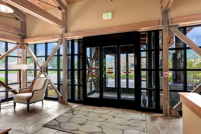 interior space featuring vaulted ceiling with beams