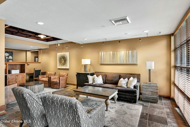 living room with a textured ceiling