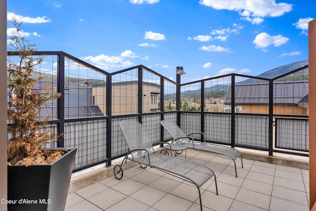 view of patio / terrace featuring a mountain view