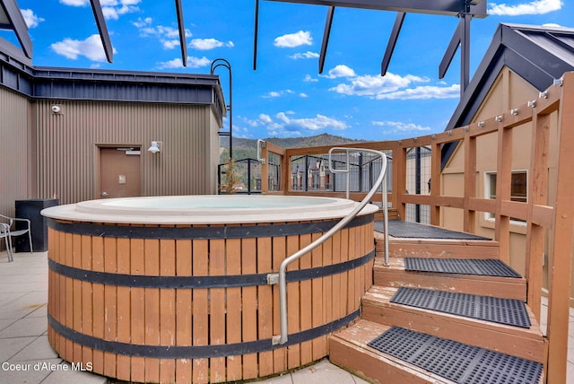 exterior space with a hot tub