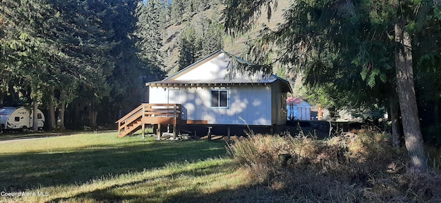 view of home's exterior featuring a yard