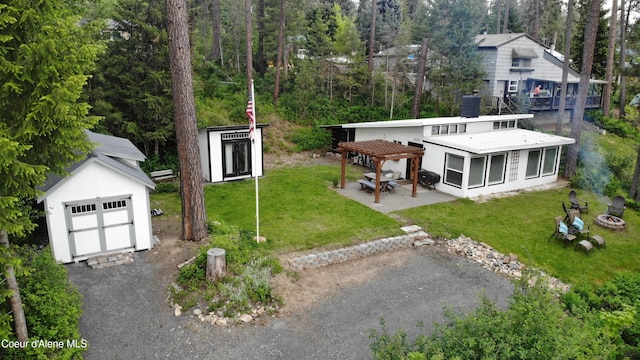 exterior space featuring a storage shed and a pergola