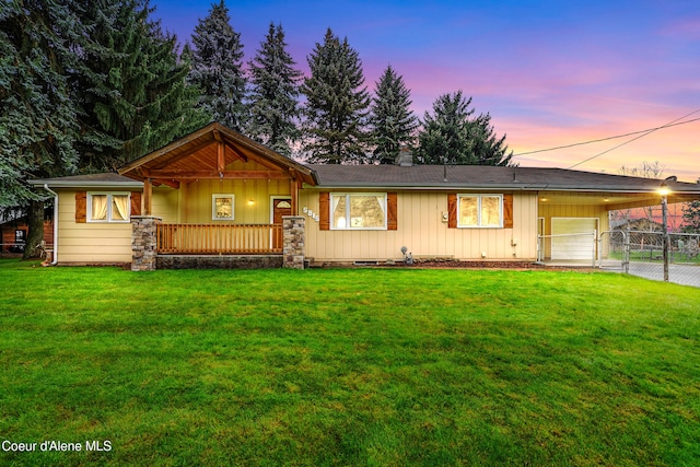 ranch-style house featuring a yard and a carport