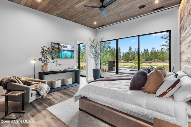 bedroom featuring light wood-type flooring, multiple windows, ceiling fan, and wooden ceiling