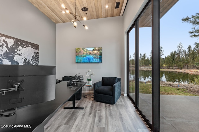 office with high vaulted ceiling, wood-type flooring, wooden ceiling, and an inviting chandelier