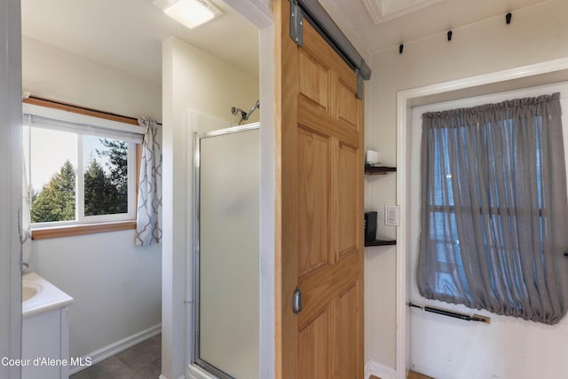 431 E Sunnyside Rd, Sandpoint, ID 83864 - bathroom with a shower stall, baseboards, tile patterned flooring, and vanity