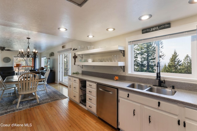431 E Sunnyside Rd, Sandpoint, ID 83864 - kitchen with dishwasher, a sink, open shelves, white cabinetry, and light wood-style flooring