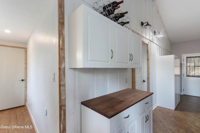 431 E Sunnyside Rd, Sandpoint, ID 83864 - kitchen with butcher block counters, light wood-style flooring, and white cabinets
