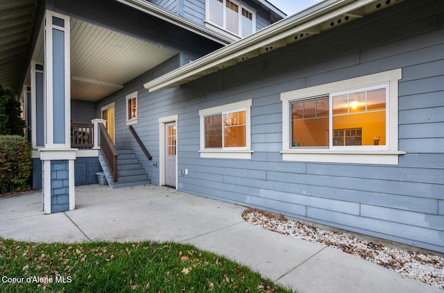 view of side of property featuring a patio area