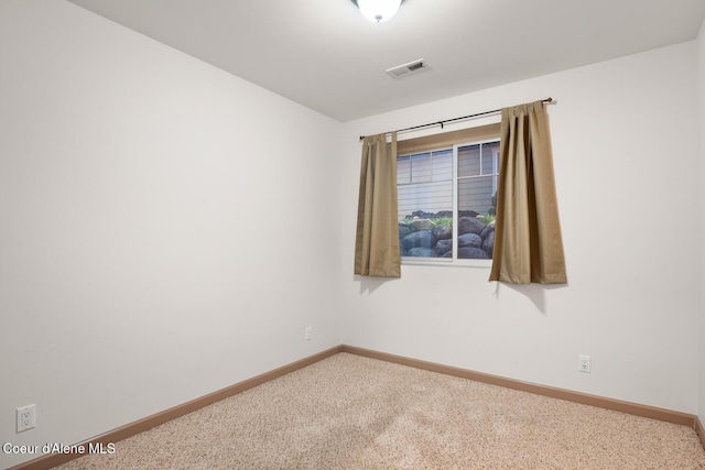 unfurnished room featuring carpet