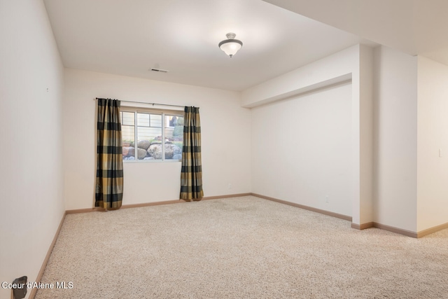 unfurnished room with carpet floors