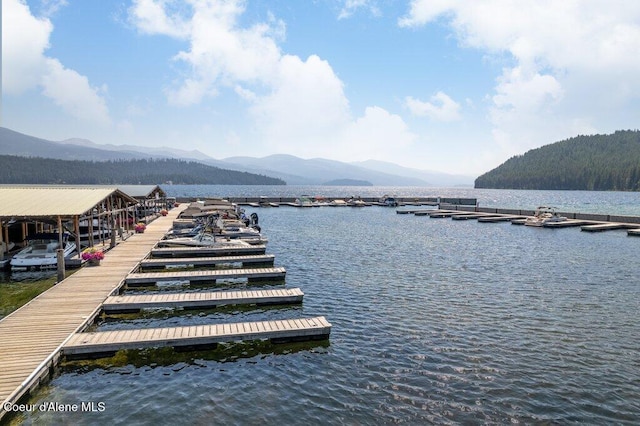 dock area featuring a water and mountain view