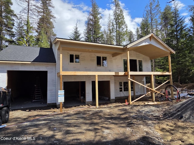 240 Brown Bear Dr, Nordman, ID 83848 - property in mid-construction featuring stucco siding and a garage