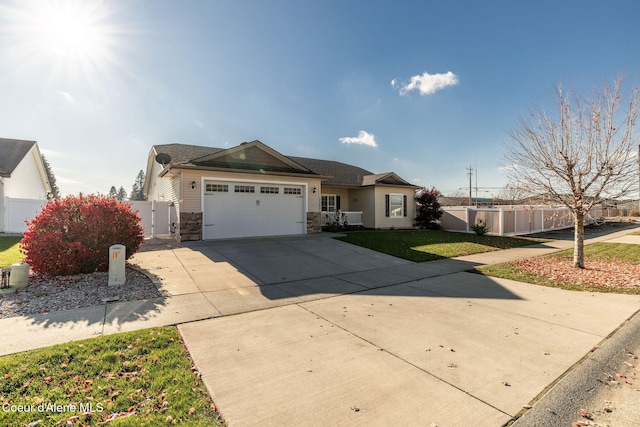 view of front facade with a garage and a front yard