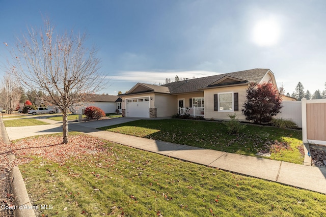 single story home featuring a front yard and a garage