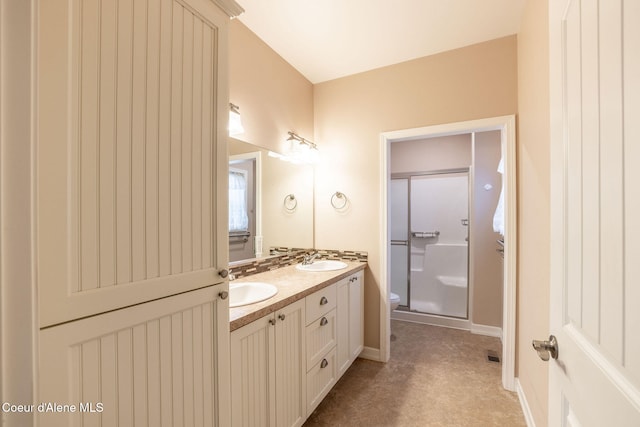 bathroom with vanity, an enclosed shower, and toilet