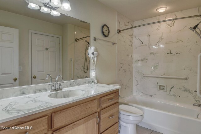 bathroom with vanity, shower / bathing tub combination, and toilet