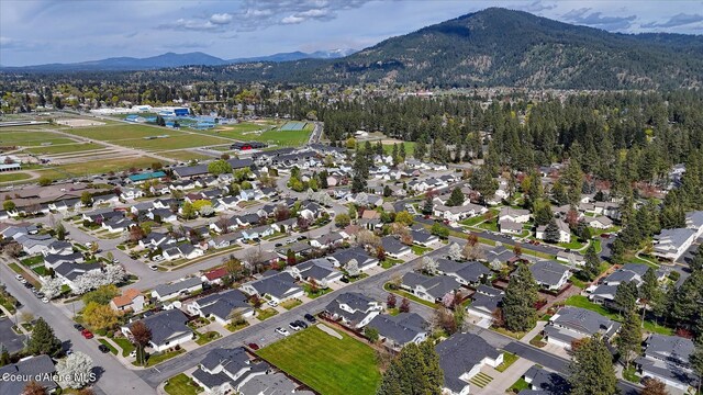drone / aerial view with a mountain view and a residential view