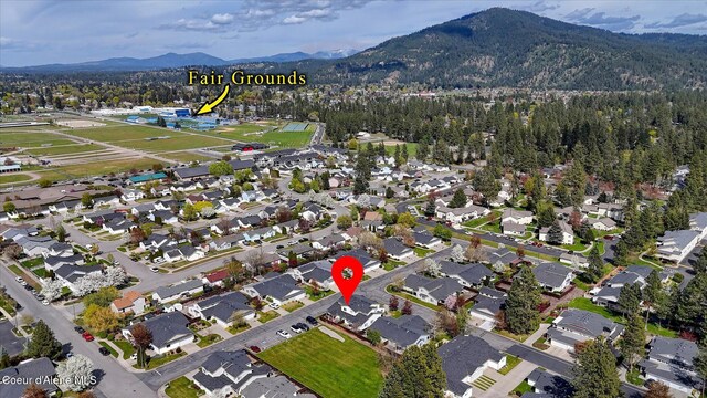 birds eye view of property featuring a residential view and a mountain view