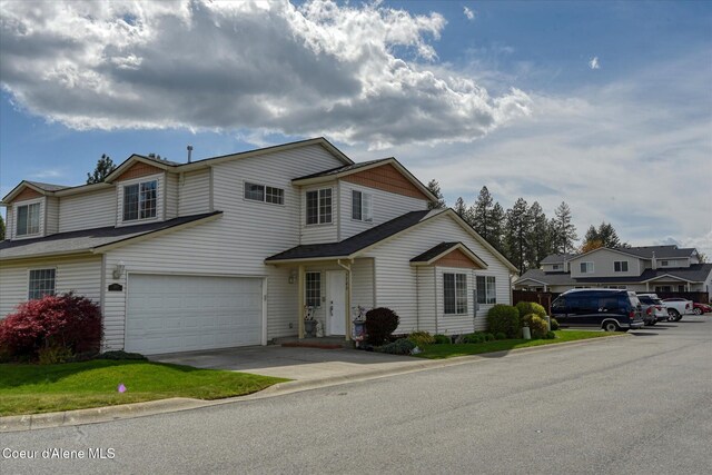 view of front of home featuring a garage and concrete driveway