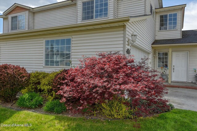 view of side of home with an attached garage