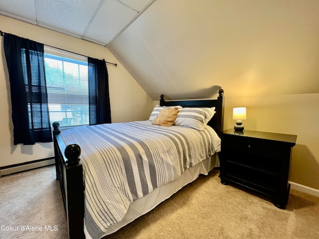 carpeted bedroom with a baseboard radiator and lofted ceiling