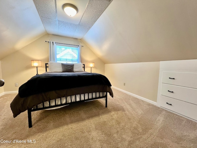 carpeted bedroom featuring vaulted ceiling