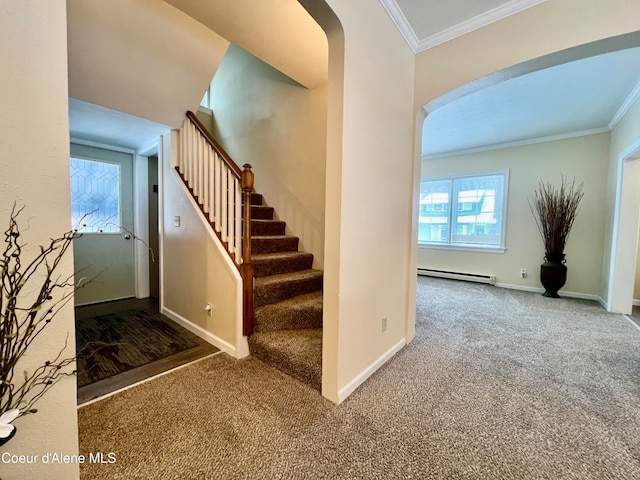 stairway featuring carpet floors, baseboard heating, and ornamental molding