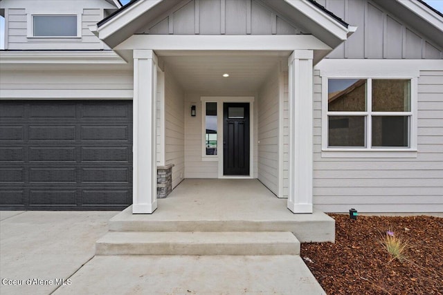 view of exterior entry featuring a garage