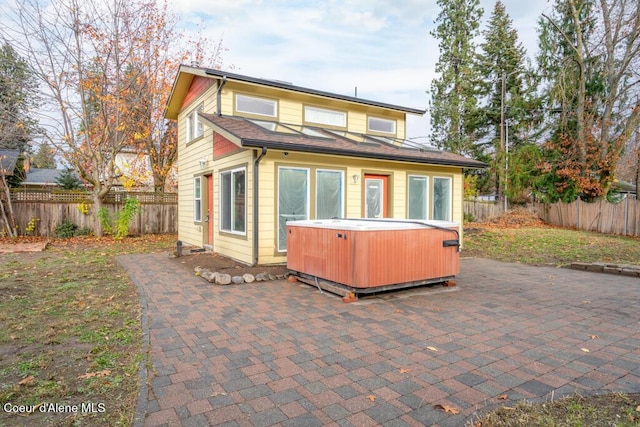 510 N Hubbard, Coeur Dalene, ID 83814 - back of property with a hot tub, a patio, and a fenced backyard