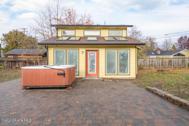510 N Hubbard, Coeur Dalene, ID 83814 - view of front facade featuring a hot tub, a patio, and a fenced backyard