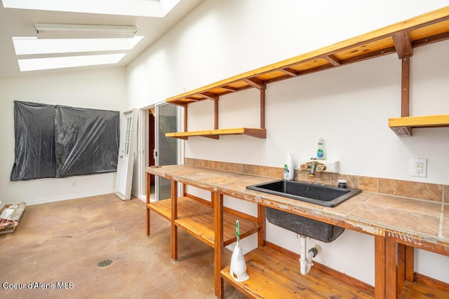 510 N Hubbard, Coeur Dalene, ID 83814 - kitchen with a skylight, open shelves, concrete floors, tile countertops, and lofted ceiling