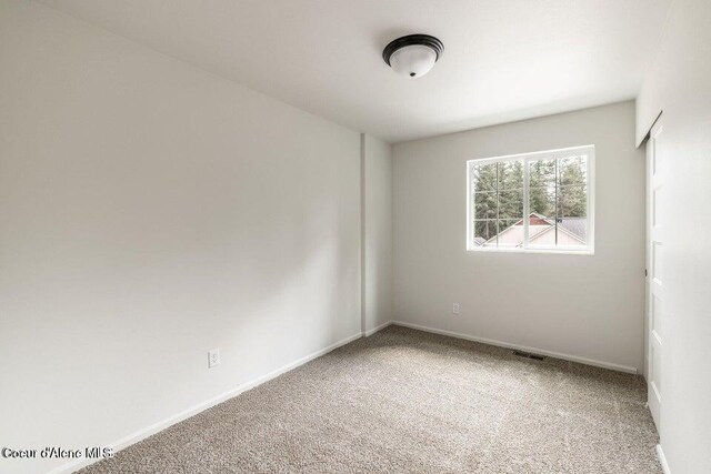 unfurnished room with carpet floors