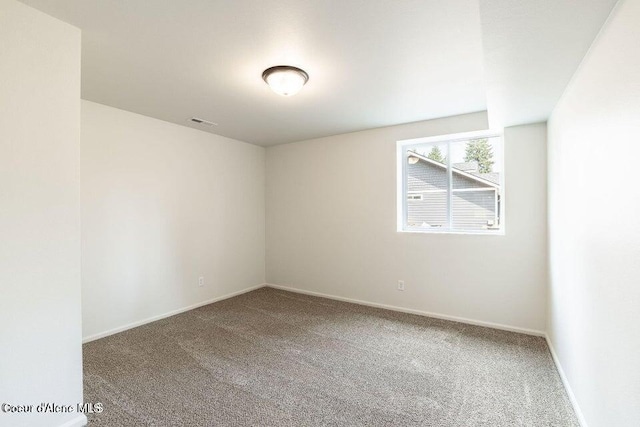 spare room with carpet floors