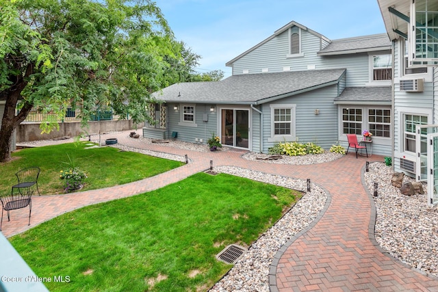 530 W Harrison Ave, Coeur Dalene, ID 83814 - back of house with a patio and a shingled roof