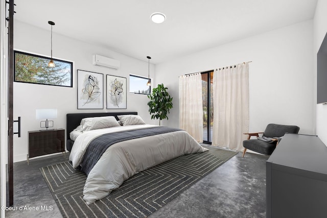 bedroom featuring a wall mounted air conditioner and concrete flooring