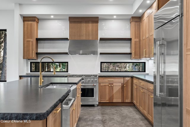 kitchen featuring concrete flooring, open shelves, a sink, high quality appliances, and decorative backsplash