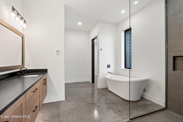 full bathroom with concrete floors, vanity, baseboards, a soaking tub, and recessed lighting