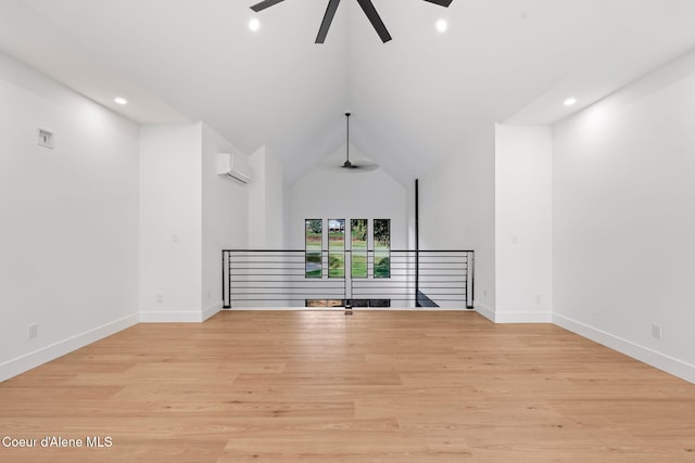 spare room featuring baseboards, recessed lighting, a wall unit AC, ceiling fan, and light wood finished floors