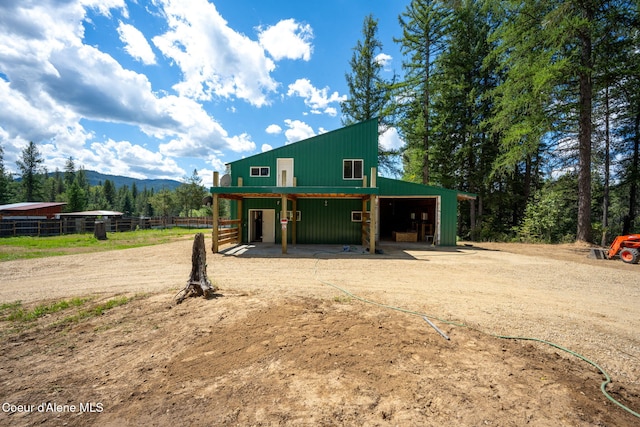 view of front of property featuring an outbuilding and a mountain view