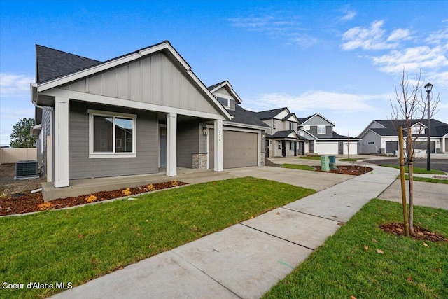 view of front of property with central AC unit, a porch, and a front yard