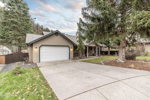 view of front facade with a front yard and a garage