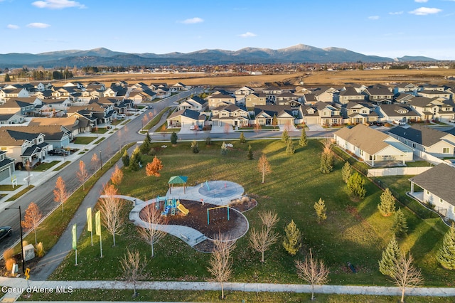 birds eye view of property with a mountain view