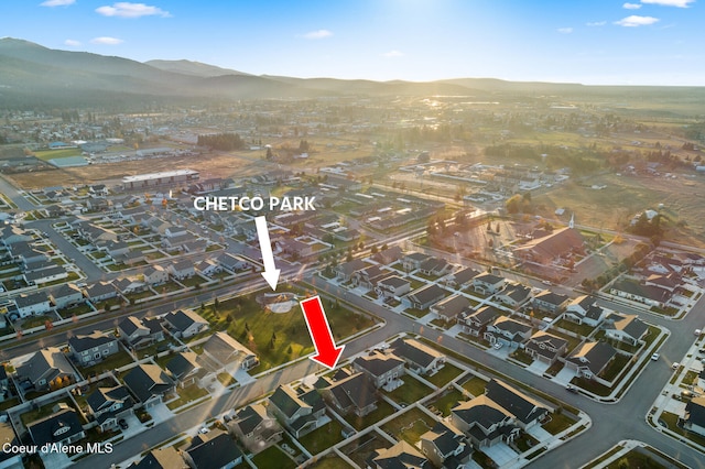 birds eye view of property with a mountain view