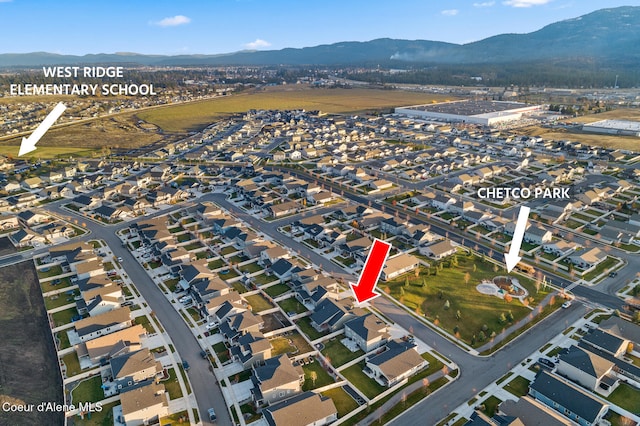 birds eye view of property featuring a mountain view